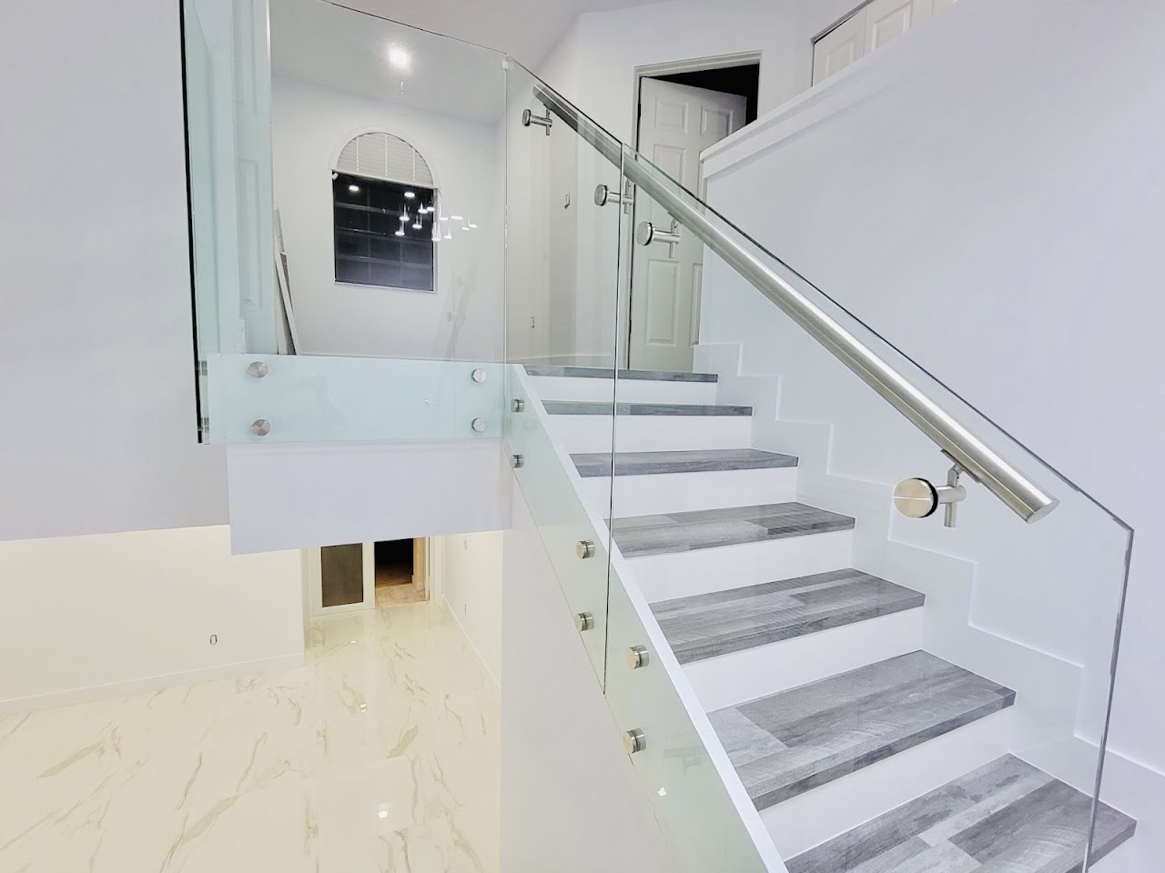 White staircase with glass panels
